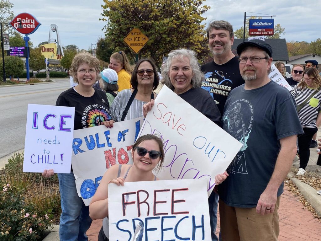 UUCCHC members holding signs at a rally
